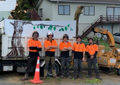 Zoomed out Elite Arboriculture Expert team photo with a cone